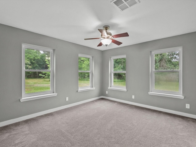 3422 N Elm Rd, Santa Fe, TX 77517 - unfurnished room featuring healthy amount of natural light, a ceiling fan, and baseboards