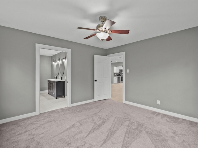 3422 N Elm Rd, Santa Fe, TX 77517 - unfurnished bedroom with baseboards, carpet flooring, and ensuite bathroom