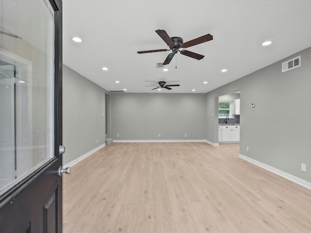 3422 N Elm Rd, Santa Fe, TX 77517 - spare room featuring ceiling fan, light wood-type flooring, a sink, recessed lighting, and baseboards