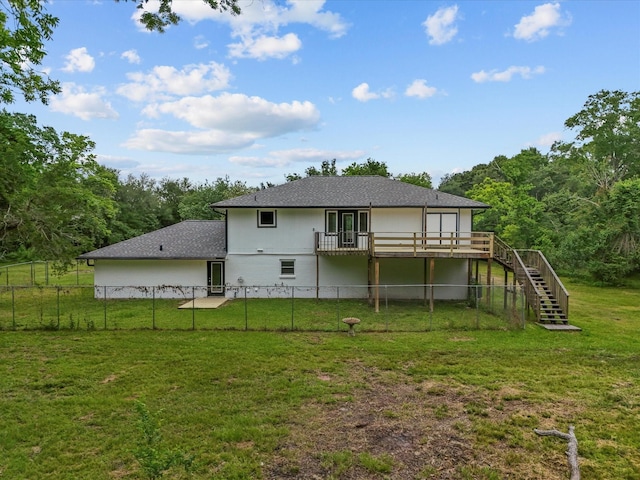 3422 N Elm Rd, Santa Fe, TX 77517 - back of house with stairs, a wooden deck, stucco siding, and a wooded view