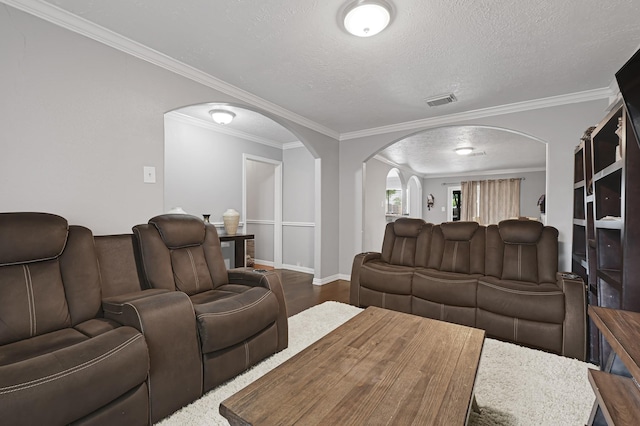 7162 Crownwest St Unit 7162, Houston, TX 77072 - living room with arched walkways, a textured ceiling, crown molding, baseboards, and dark wood-style floors
