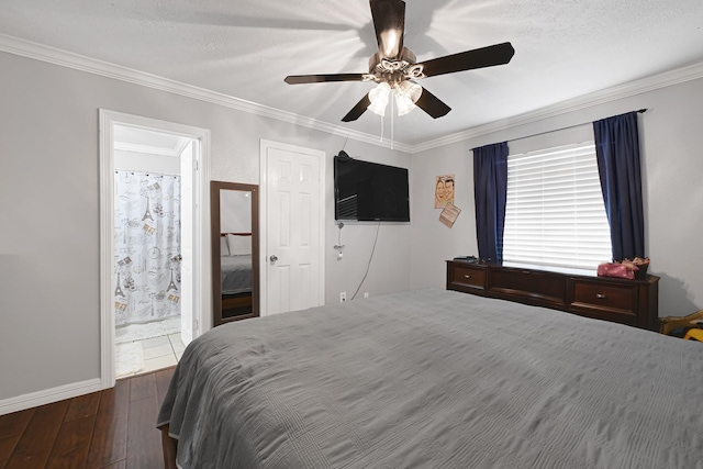 7162 Crownwest St Unit 7162, Houston, TX 77072 - bedroom with dark wood-style floors, ornamental molding, a ceiling fan, baseboards, and ensuite bathroom
