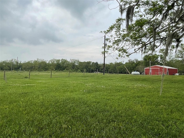 3295 Fm 524, Sweeny, TX 77480 - view of grassy yard with a pole building, an outbuilding, and a view of countryside