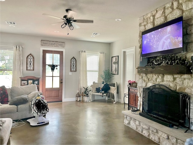 3295 Fm 524, Sweeny, TX 77480 - living area featuring a fireplace, a ceiling fan, baseboards, finished concrete flooring, and recessed lighting