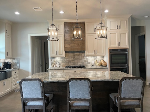 3295 Fm 524, Sweeny, TX 77480 - kitchen with black appliances, a chandelier, decorative backsplash, hanging light fixtures, and recessed lighting