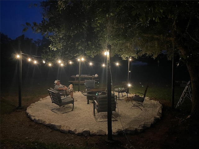 3295 Fm 524, Sweeny, TX 77480 - patio at twilight featuring a fire pit