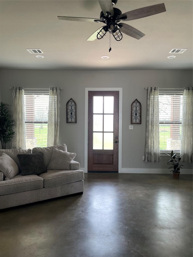 3295 Fm 524, Sweeny, TX 77480 - living room featuring plenty of natural light, concrete floors, baseboards, and recessed lighting