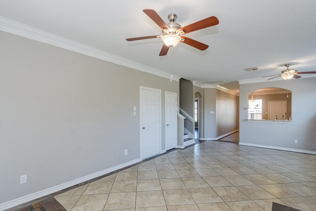 1802 Dominic Ln, Houston, TX 77049 - unfurnished room featuring arched walkways, ceiling fan, crown molding, stairs, and baseboards