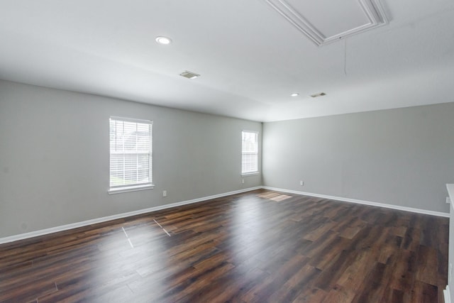 1802 Dominic Ln, Houston, TX 77049 - empty room featuring attic access, plenty of natural light, dark wood-type flooring, baseboards, and recessed lighting