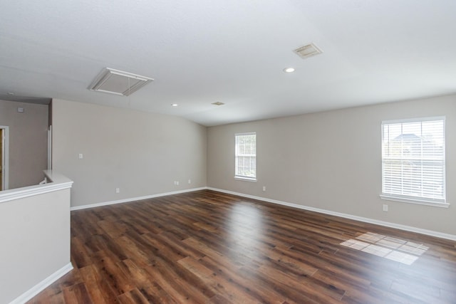 1802 Dominic Ln, Houston, TX 77049 - unfurnished room with attic access, baseboards, dark wood-style flooring, and recessed lighting