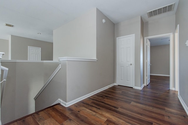 1802 Dominic Ln, Houston, TX 77049 - hallway with an upstairs landing, dark wood-style floors, and baseboards
