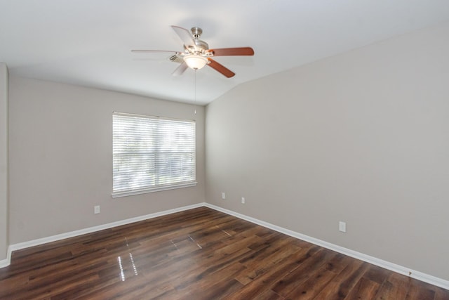 1802 Dominic Ln, Houston, TX 77049 - spare room featuring a ceiling fan, baseboards, dark wood-type flooring, and vaulted ceiling
