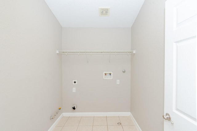 1802 Dominic Ln, Houston, TX 77049 - laundry room with hookup for a gas dryer, washer hookup, light tile patterned floors, and baseboards