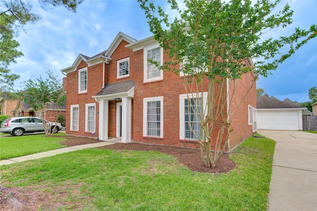 1322 Village Garden Dr, Missouri City, TX 77459 - view of front of property featuring a front lawn, brick siding, and a detached garage