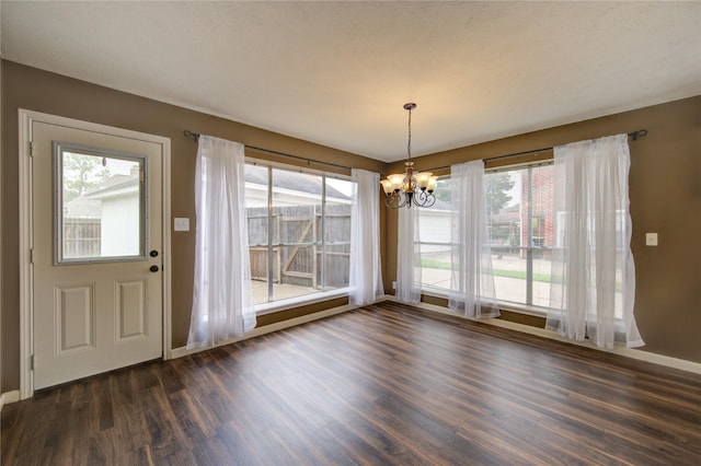 1322 Village Garden Dr, Missouri City, TX 77459 - unfurnished dining area featuring a chandelier, dark wood-style flooring, and plenty of natural light
