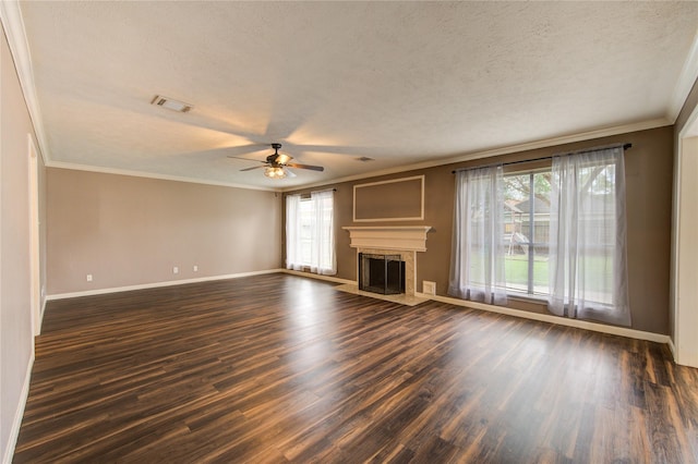 1322 Village Garden Dr, Missouri City, TX 77459 - unfurnished living room featuring ceiling fan, a textured ceiling, dark wood finished floors, crown molding, and a fireplace with flush hearth