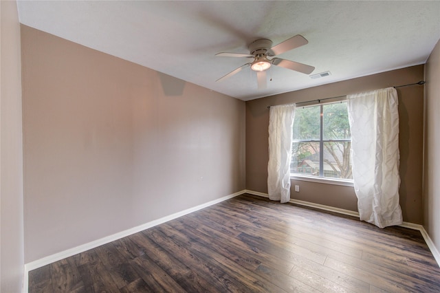 1322 Village Garden Dr, Missouri City, TX 77459 - spare room featuring a ceiling fan and dark wood-style floors