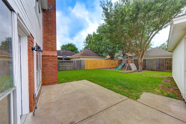 1322 Village Garden Dr, Missouri City, TX 77459 - fenced backyard with a patio area and a playground
