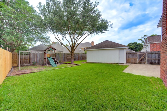 1322 Village Garden Dr, Missouri City, TX 77459 - fenced backyard featuring a playground and a patio area