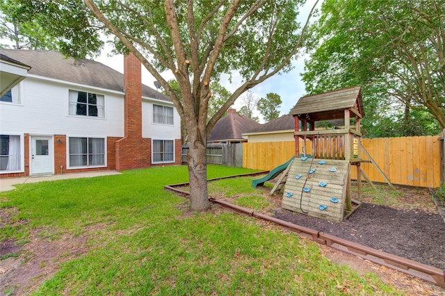 1322 Village Garden Dr, Missouri City, TX 77459 - fenced backyard with a playground
