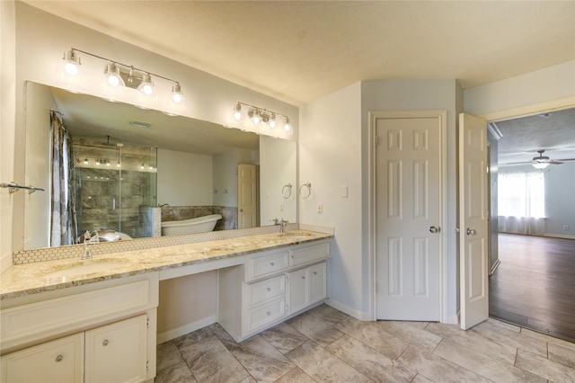 1322 Village Garden Dr, Missouri City, TX 77459 - full bath featuring a stall shower, double vanity, a freestanding bath, and a ceiling fan