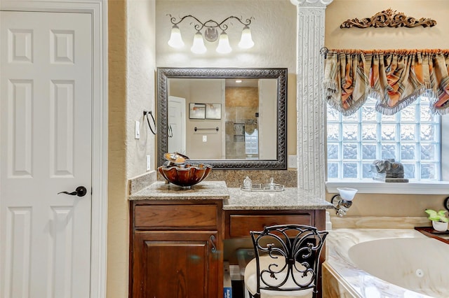 8215 Frontenac Dr, Houston, TX 77071 - bathroom featuring a textured wall, a tub with jets, vanity, and a shower