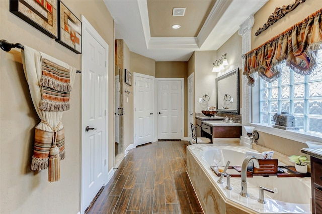 8215 Frontenac Dr, Houston, TX 77071 - full bath featuring a bath, vanity, a raised ceiling, a closet, and wood finished floors