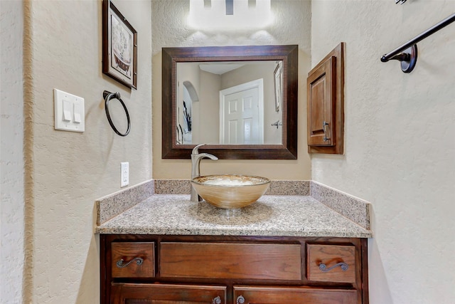 8215 Frontenac Dr, Houston, TX 77071 - bathroom featuring a textured wall and vanity