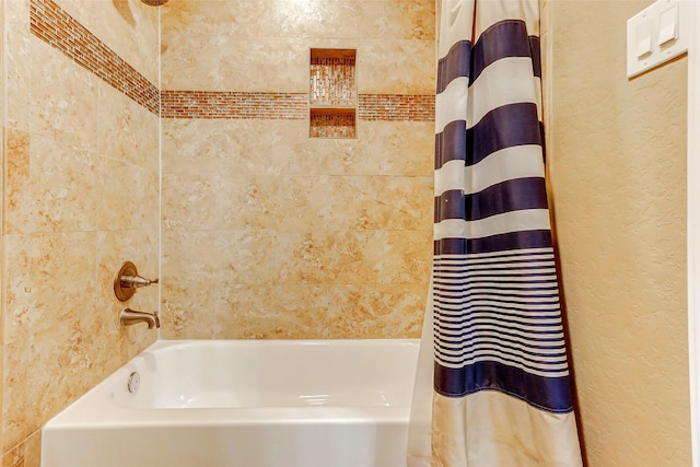 8215 Frontenac Dr, Houston, TX 77071 - bathroom with shower / bath combo and a textured wall