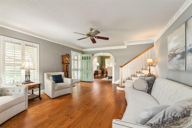 916 E James St, Baytown, TX 77520 - living room with arched walkways, wood-type flooring, plenty of natural light, and stairs