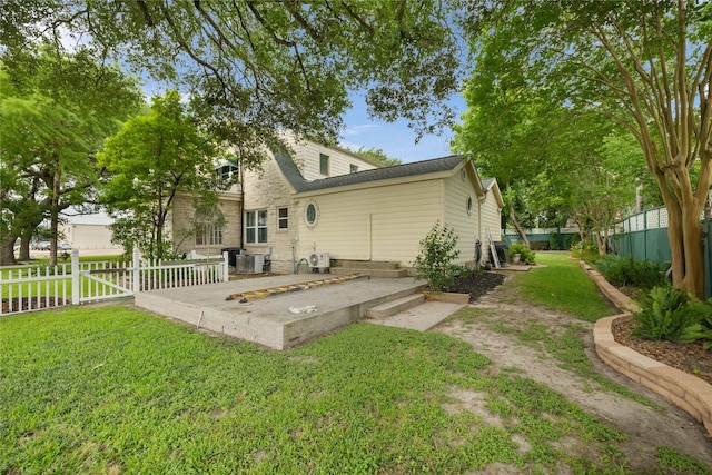 916 E James St, Baytown, TX 77520 - rear view of house with central AC and a shingled roof