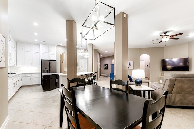 28515 Blue Holly Ln, Katy, TX 77494 - dining area with arched walkways, light tile patterned flooring, a ceiling fan, and recessed lighting