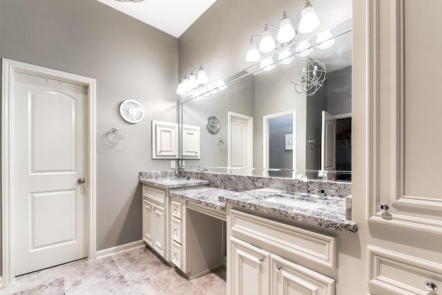 28515 Blue Holly Ln, Katy, TX 77494 - bathroom with double vanity, a chandelier, and baseboards