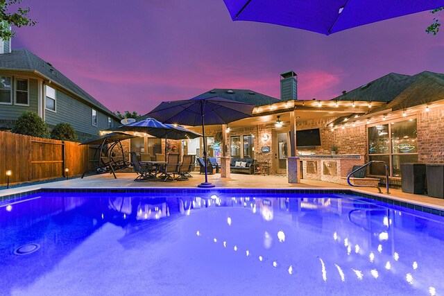 28515 Blue Holly Ln, Katy, TX 77494 - view of pool featuring exterior kitchen, a patio, and outdoor dining area