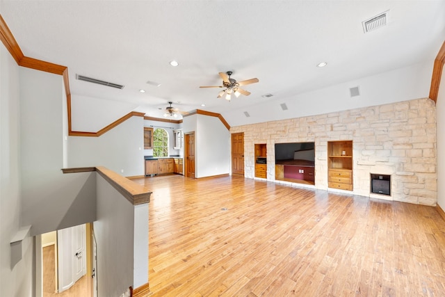 2042 Darby Ln, Fresno, TX 77545 - unfurnished living room featuring ceiling fan, light wood-type flooring, ornamental molding, recessed lighting, and a fireplace