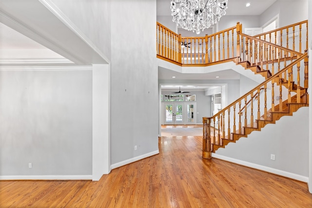 2042 Darby Ln, Fresno, TX 77545 - entrance foyer with stairs, baseboards, wood finished floors, a chandelier, and ceiling fan