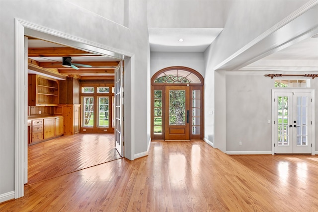 2042 Darby Ln, Fresno, TX 77545 - entryway featuring plenty of natural light, light wood-style floors, ceiling fan, baseboards, and a towering ceiling