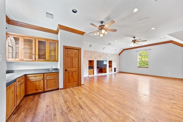 2042 Darby Ln, Fresno, TX 77545 - kitchen with a ceiling fan, a sink, lofted ceiling, light wood-style floors, and crown molding
