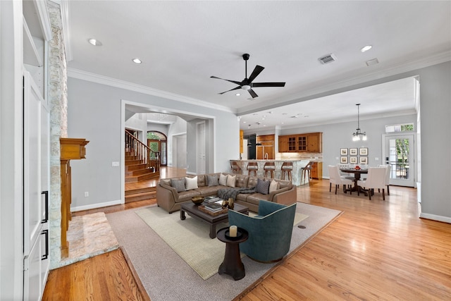 2042 Darby Ln, Fresno, TX 77545 - living area with light wood-style flooring, stairway, a fireplace, baseboards, and recessed lighting