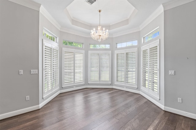 2042 Darby Ln, Fresno, TX 77545 - empty room with a chandelier, plenty of natural light, dark wood finished floors, a raised ceiling, and ornamental molding