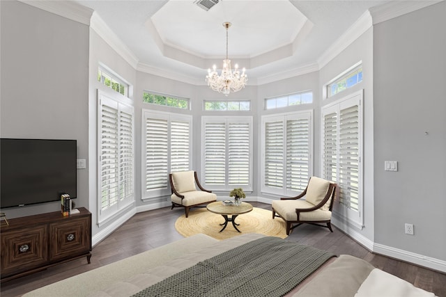 2042 Darby Ln, Fresno, TX 77545 - living area with plenty of natural light, a chandelier, a tray ceiling, wood finished floors, and crown molding