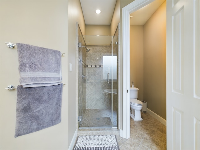 6319 Riverview Way, Houston, TX 77057 - bathroom featuring a stall shower, toilet, tile patterned floors, and baseboards