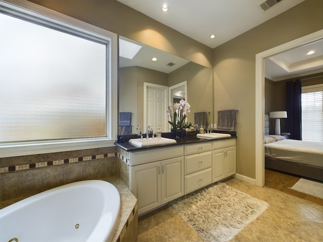 6319 Riverview Way, Houston, TX 77057 - full bathroom featuring double vanity, ensuite bathroom, a jetted tub, and recessed lighting