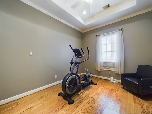 6319 Riverview Way, Houston, TX 77057 - exercise area with wood finished floors, a tray ceiling, baseboards, ornamental molding, and a ceiling fan