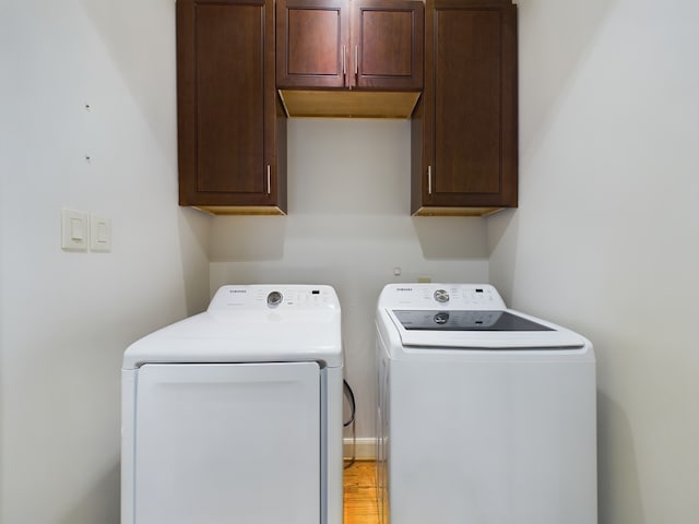 6319 Riverview Way, Houston, TX 77057 - laundry area featuring washing machine and clothes dryer and cabinet space