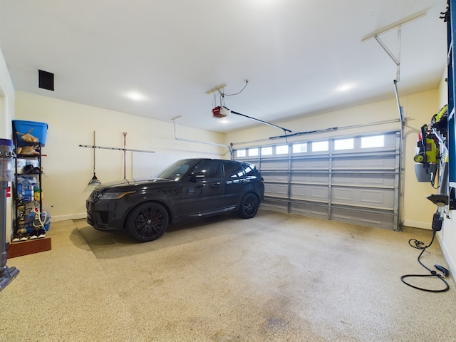 6319 Riverview Way, Houston, TX 77057 - garage with a garage door opener and baseboards