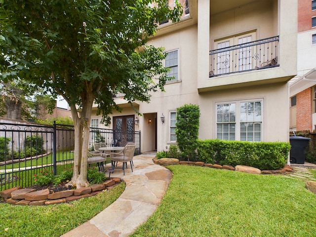 6319 Riverview Way, Houston, TX 77057 - view of front of property featuring stucco siding, french doors, a balcony, and a patio