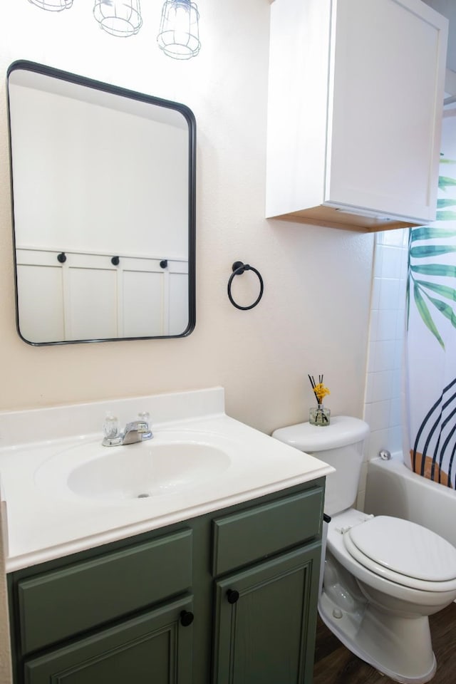 30615 S Sulphur Creek Dr, Magnolia, TX 77355 - full bathroom featuring vanity, toilet, shower / bath combo with shower curtain, and wood finished floors