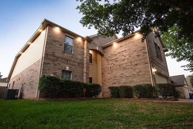 30615 S Sulphur Creek Dr, Magnolia, TX 77355 - view of front facade with brick siding, central air condition unit, a front lawn, and a garage