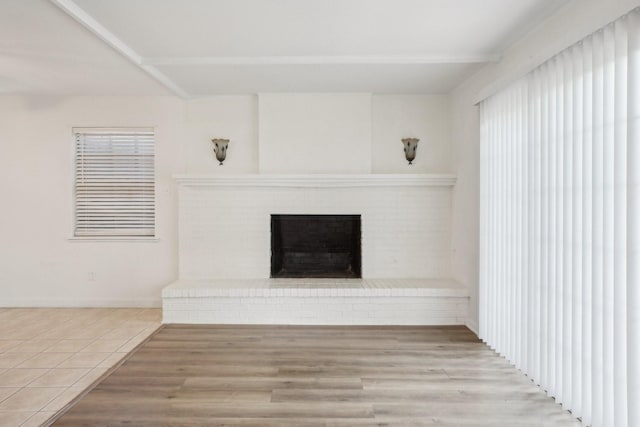 2112 Leyte Dr, Tool, TX 75143 - unfurnished living room featuring a fireplace, healthy amount of natural light, and wood finished floors